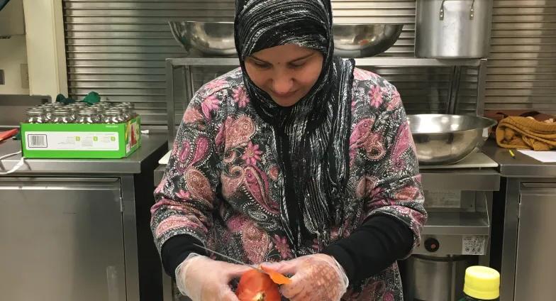 woman slicing tomato